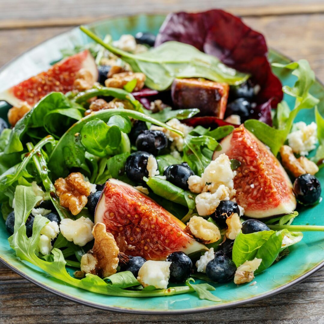 Tasty autumn salad with figs and blueberries