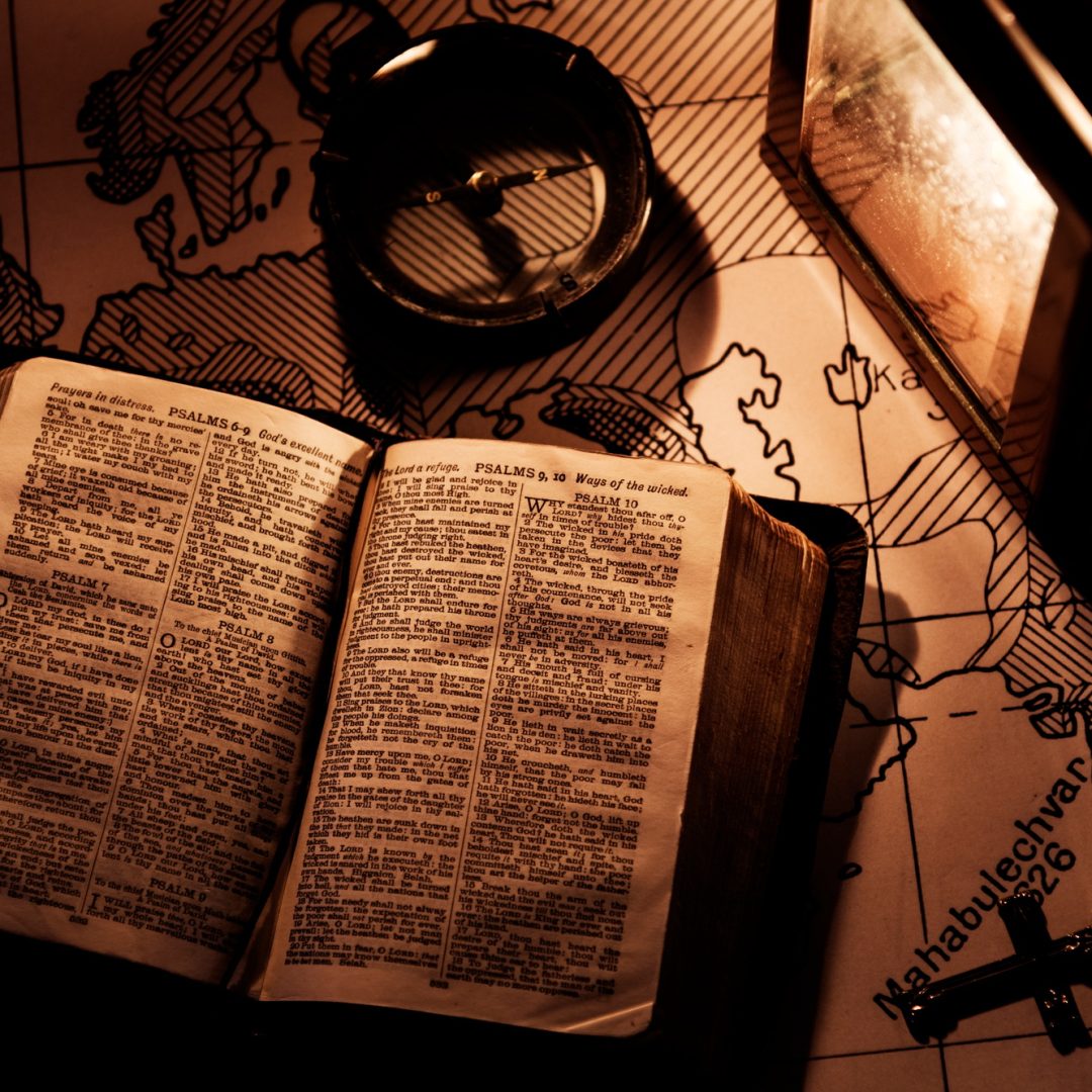 An old bible on a wooden table